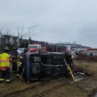 <p>First responders on the scene of a rollover crash on Route 7 in Danbury Saturday.</p>