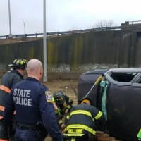 <p>Firefighters, state troopers and EMS on the scene of the rollover crash in Danbury.</p>