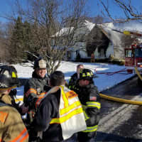 <p>Firefighters on scene of a fire on Muirwood Court in Brookfield on Thursday</p>