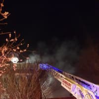 <p>The Danbury Fire Department knocks down a blaze in a building at 276 Main St. on Christmas night. </p>