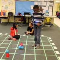 <p>A third-grader at Highview Elementary School sends commands to robots Dash and Dot to help his team complete a mission. </p>