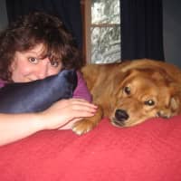 <p>Ryan Schwertfeger wants to name the proposed Oakland dog park after his later mother Jill Schwertfeger. She is pictured here with their dog Scooby.</p>