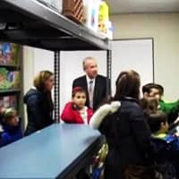 <p>Members of the the Wigod family explore the renovated Fair Lawn Food Pantry with Mayor John Cosgrove. </p>