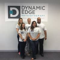 <p>Sam Hopkins, back row, right, and Patrick Buckley, back row, middle, stand with their staff at Dynamic Edge PhysioTherapy in Wilton.</p>