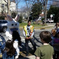 <p>Children line up to meet the Easter Bunny</p>