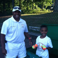 <p>Elijah Patterson, right, the grandson of Slammer Tennis World&#x27;s Marvin Tyler and a future tennis star, helped out at the tournament.</p>