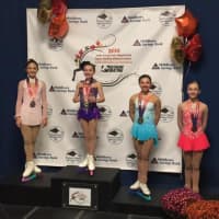 <p>Emilia Murdock, second from left, wins the gold medal in the Intermediate Ladies category of the New England Regionals of U.S. Figure Skating. She competes this week at Sectionals as she continues her road to competing at nationals. </p>