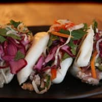 <p>The ahi tuna bahn mi on steamed buns is just one example of the many goodies served at the Exit 4 Food Hall in Mount Kisco.</p>