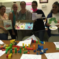 <p>Participants practice “dramatic play” at a professional development training provided by Child Care Resources of Rockland, Inc.</p>