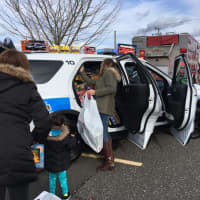 <p>A Brookfield Police cruiser is loaded with toys for kids at Connecticut Children&#x27;s Medical Center in Hartford.</p>