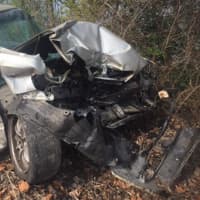 <p>The front of this car was demolished when it was struck Friday by an Amtrak train in Hyde Park. The two people inside had escaped safely and no one on the train was injured.</p>