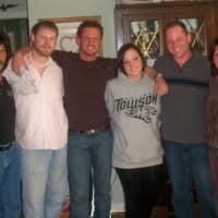 <p>Nick Arnoldi, center, with his family three years before he killed himself.</p>