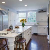 <p>The home&#x27;s kitchen includes modern appliances and a marble countertop.</p>