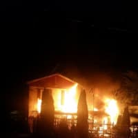 <p>Firefighters respond to a three-alarm blaze at 9 Stevens St. in Danbury just after midnight.</p>
