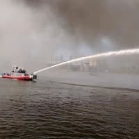 <p>The Bridgeport Fire Department&#x27;s fireboat battles a blaze at an empty factory on Friday afternoon, </p>
