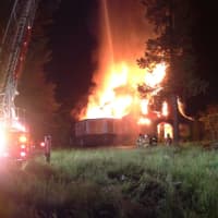 <p>Newtown Hook &amp; Ladder battles a blaze in a vacant home early Wednesday on Castle Hill Road.</p>