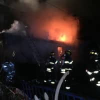 <p>Firefighters respond to a three-alarm blaze at 9 Stevens St. in Danbury just after midnight.</p>