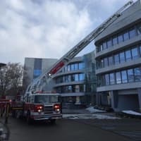 <p>Greenwich firefighters turn out to battle a small blaze on the roof of 100 W. Putnam Ave. on Sunday morning.</p>