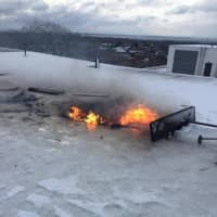 <p>The damage was limited to the roof of the office building at 100 W. Putnam Ave. as well as the office below the blaze.</p>