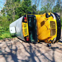 <p>The school bus on its side.</p>