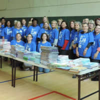 <p>NFEP members and books that will be distributed free to Norwalk students as part of the &quot;First Book&quot; initiative.</p>