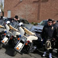<p>Westport police pay their respects at the Mass of Christian Burial for retired Norwalk police Lt. Tim Murphy.</p>