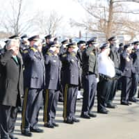 <p>Members of the Norwalk Police Department, joined by former chief and current Mayor Harry Rilling, salute retired Lt. Tim Murphy after his Mass of Christian Burial on Saturday at St. Aloysius Church in New Canaan.</p>