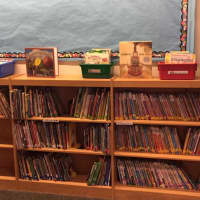<p>A Fairfield woman founded an organization called Brighter Lives for Kids which helps provide supplies to a Bridgeport public school like these books.</p>