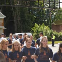 <p>The students march through the gates as they are welcomed Friday at Western Connecticut State University in Danbury. </p>