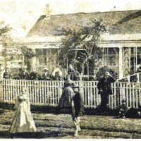 <p>A gathering at 20 Main Street circa the 1870s.&nbsp;</p>