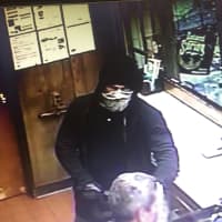 <p>Surveillance footage of the suspect in the robbery of a gas station in Greenwich.</p>