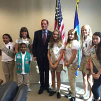 <p>From left: Girl Scouts Katie Lopez, Melanie Valdes, Gaita Cisse (in front of her), Angelica DeDominicis, Kayla Michaud, Cecilie Johnsrud, and Tristen Connelly pose with U.S. Sen. Richard Blumenthal. </p>