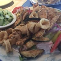 <p>A &quot;pikilia&quot; platter is piled with Mediterranean treats like eggplant, stuffed grape leaves and calamari at Gyro World in Pleasantville.</p>