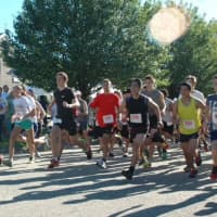 <p>Runners compete in a past Village Halloween 5K &amp; Fun Walk, which takes place Saturday, Oct. 29, in Shelton.</p>