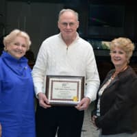 <p>Fran Mayko, AAA Northeast’s public affairs manager, presents Raymond “Joe” Hansen with a Traffic Safety Hero Award at a Traffic Safety Community Awards Lunch in Bridgeport.  At left is Hansen&#x27;s wife, Liz.</p>