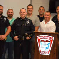 <p>Officers from Brookfield and Ridgefield gathered to welcome and congratulate Officer Terry Hawaux on joining the Brookfield Police Department.</p>