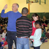 <p>Town Supervisor Paul Feiner is sworn in by Highview Elementary School students.</p>
