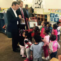 <p>U.S. Rep. Jim Himes and U.S. Sen. Chris Murphy visit with the kids at ABCD in Bridgeport on Monday. </p>