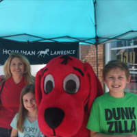 <p>Clifford joins a family for a picture at the festival.</p>