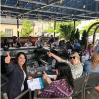 <p>Customers sit outside on a new patio at Augie&#x27;s Prime Cut steakhouse in Yorktown.</p>