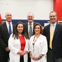 <p>members of ColumbiaDoctors and Careers in Medicine with Eastchester Schools Superintendent Walter Moran and High School Principal Jeff Capuano</p>