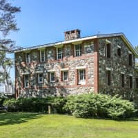 <p>One Willow Island is a two-story restored stone colonial.</p>
