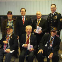 <p>Assemblyman David Buchwald stands with veterans at West Patent Elementary School in Bedford Hills during the Valentines for Vets launch assembly on Thursday.</p>