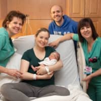<p>New family joined by nurses from the Kennedy Birthing Center at St. Anthony Community Hospital.</p>