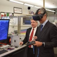 <p>Italian Consulate General Francesco Genuardi tests out the high-tech learning tools at Bergen Academies in Hackensack.</p>