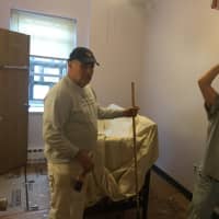 <p>Some menbers of the Knights of Columbus get to work painting one of the bedrooms at the Malta House.</p>