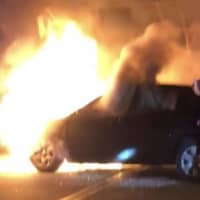 <p>The car caught fire at 11:45 p.m. on Palisade Avenue at Route 80.</p>