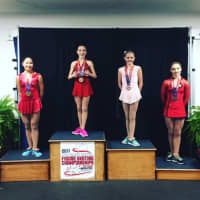 <p>Emilia Murdock of Darien, second from left, wins the intermediate ladies title for the New England Region. Also on the podium are Maddie Weiler, second, left; Mauryn Tyack, third, third from left; and Julia Curran, fourth, at right.</p>