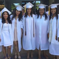 <p>A group of happy graduates celebrates at Norwalk High School on Tuesday evening.</p>