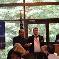 <p>Knights Of Columbus Council 14360 Grand Knight presents a gift to the Rev. Reggie Norman after his Communion Breakfast talk.</p>
